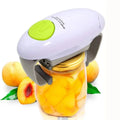 The automatic electric jar opener attached to a fruit jar ready to take off the lid. Fruit in the background.