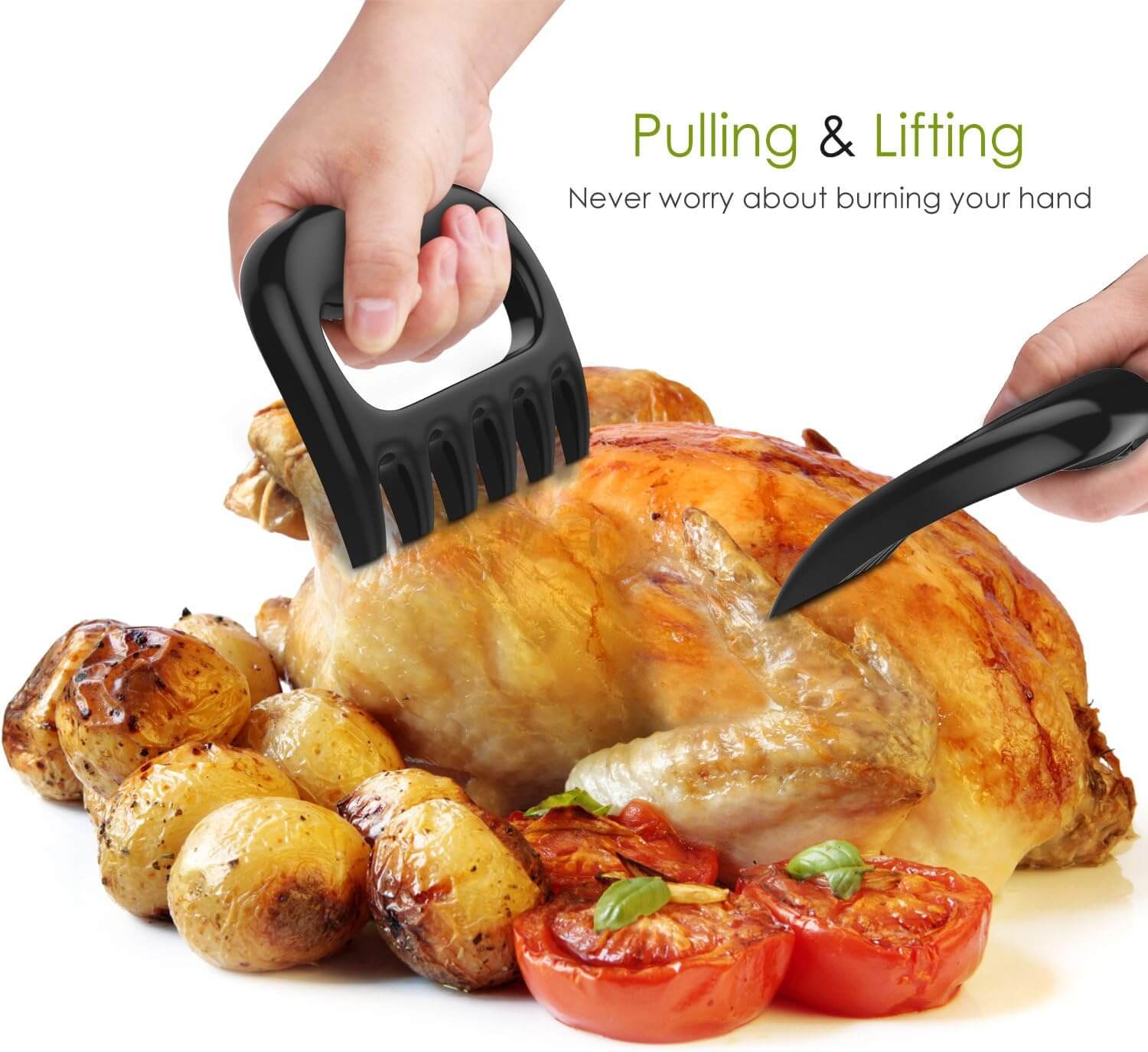 Both meat shredding claws being used to pull and lift a roast chicken next to a side of potato's and tomato's.